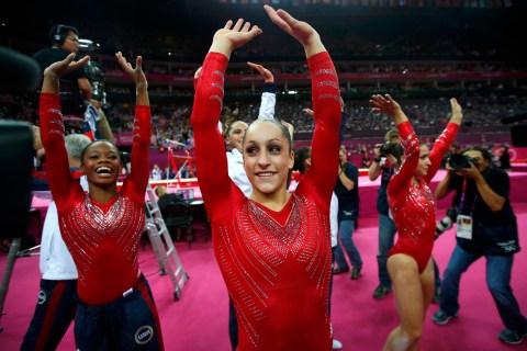 Jordyn Wieber of the U.S. and team mate Gabrielle Douglas celebrate after the women's gymnastics team final in the North Greenwich Arena at the London 2012 Olympic Games