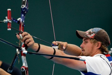 U.S. Olympic archer Brady Ellison trains at the 2012 Summer Olympics, Saturday, July 21, 2012, in London.