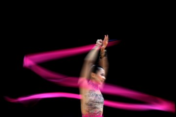 image: Senyue Deng of China competes during the Rythmic Gymnastics Individual All-Around competition on Day 14 of the London 2012 Olympic Games at Wembley Arena in London, Aug. 10, 2012.