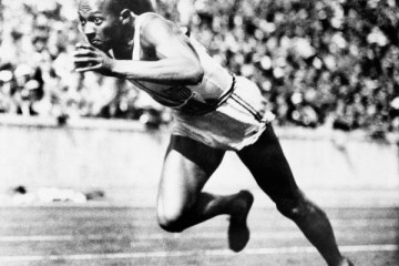 American sprint star Jesse Owens is shown in action during one of the heats of the 200-meter run August 14, 1936 in Berlin.