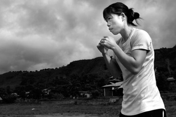 In this June 14, 2012 photo, Indian boxer and five-time world champion Mary Kom practices boxing at her residence in Langol Games village on the outskirts of Imphal, India.