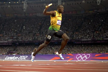 image: Jamaica's Usain Bolt crosses the finish line to win and set a new world record in the men's 4X100 relay final at the athletics event of the London 2012 Olympic Games, Aug. 11, 2012.