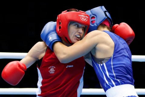 Ireland's Katie Taylor fights Russia's Sofya Ochigava during their Women's Light (60kg) gold medal boxing match at the London Olympic Games