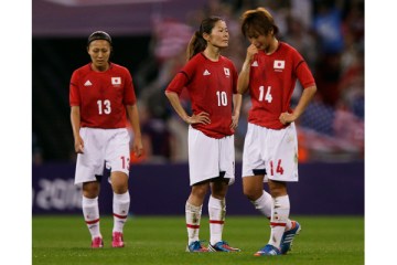 image: From left: Japan's Karina Maruyama, Homare Sawa and Asuna Tanaka react after losing the women's soccer gold medal match against the United States at the 2012 Summer Olympics in London,, Aug. 9, 2012.