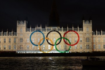 An image of the Olympic rings is displayed on the wall of the Houses of Parliament.